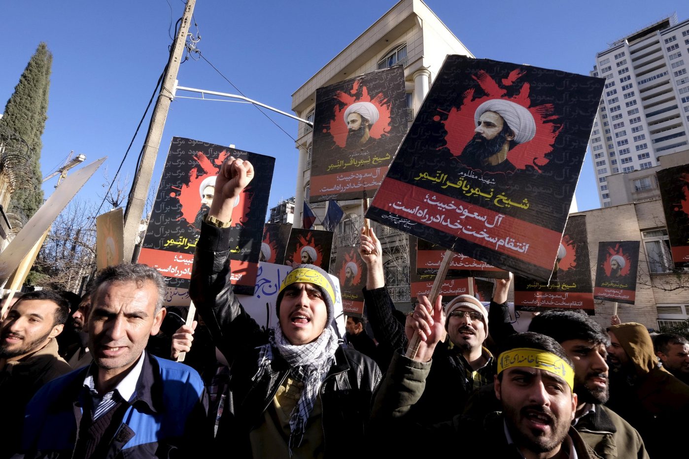 Iranian protesters chant slogans as they hold pictures of Shi'ite cleric Sheikh Nimr al-Nimr during a demonstration against the execution of Nimr in Saudi Arabia, outside the Saudi Arabian Embassy in Tehran