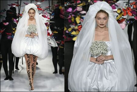 Gigi rocks the wedding dress as she steals the show