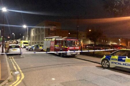 Breaking News: Police in Standoff with a man threatening to blow up a block of flats in East London