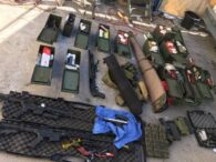 Two men arrested for workplace attack threats, many weapons found in their homes