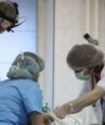 Romanian doctors fight surge in virus cases and conspiracy theories