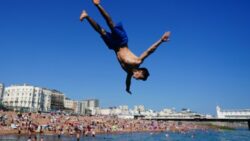 Public flocks to parks and beaches as hottest day of the year recorded in England and Wales