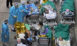 Hong Kong to allow in doctors from mainland China as Covid cases overwhelm hospitals