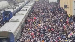 Thousands of Ukrainians pour into train station fleeing war-ruined Kharkiv