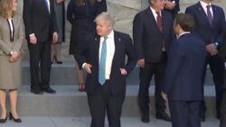 Boris Johnson looks on awkwardly as Macron and other EU leaders greet at Nato meeting