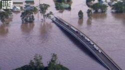 Sydney floods: two found dead, bridge inundated and suburbs across the city swamped