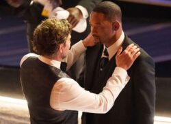 Oscars 2022: Will Smith comforted by Bradley Cooper after hitting Chris Rock in jaw-dropping moment