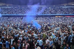 Two football fans charged after Manchester City’s pitch invasion during Premier League title win