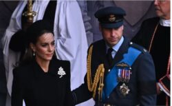 Meghan and Prince Harry hold hands as they follow William and Kate out of cathedral after Westminster service