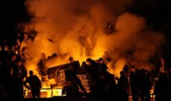 Policeman injured as fans throw chairs and flares during West Ham game