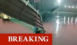 At least 60 dead as hundreds fall into river after suspension bridge collapses