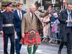 King Charles dons a kilt to wave to crowds and meet refugees in Aberdeen