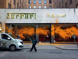 Just Stop Oil activists cover Bugatti and Ferrari car showrooms in London with orange paint