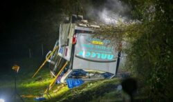 Bus on school run crashes and overturns leaving several children in hospital with injuries