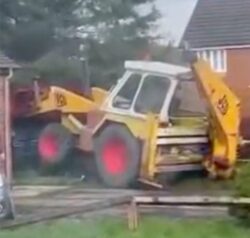 Digger driver goes on rampage and rams JCB into house and tries to flip car