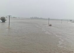 Flooded river searched for ‘person in water’ after extreme weather hits UK