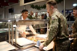 Rishi Sunak praises troops and serves them Christmas lunch at a military base in Estonia