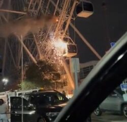 Ferris wheel bursts into flames with 62 people trapped in pods