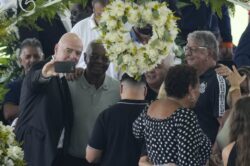 FIFA president Gianni Infantino poses for selfie next to Pele’s open casket