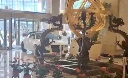 Furious guest smashes sports car through luxury hotel lobby
