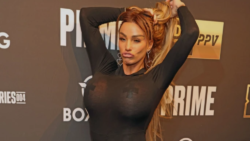 Katie Price proudly showcases results of 16th boob job in tight-fitting jumpsuit as she joins son Junior, 17, at KSI v FaZe Temperrr boxing match