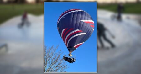 Hot air balloon with ‘suspended skatepark’ seen floating over English countryside