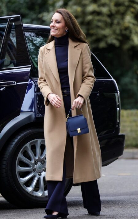 Kate Middleton rewears camel coat with navy ensemble for Slough visit