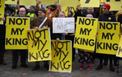 Anti-monarchists hold ‘not my King’ signs at Commonwealth Day service