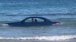 BMW washed out to sea after driver parks on beach and forgets about the tide