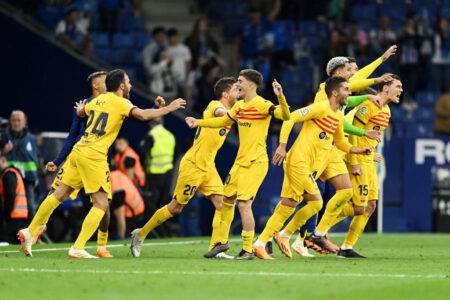 Barcelona chased off pitch by Espanyol fans while celebrating La Liga title