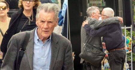 Sir Michael Palin, 79, comforted by friend in grieving comedian’s first public outing since wife’s death