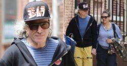 Daniel Day-Lewis, 66, spotted in public for first time in years sporting long hair and a smile