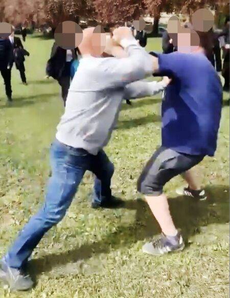 Shocking moment brawl breaks out on a school field – between two dads