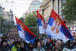 Tens of thousands march against Serbian leadership after mass shootings