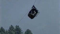 Pakistani rescuers try to free 6 kids and 2 men in a cable car dangling hundreds of feet in the air