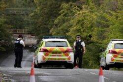 Two people die after driving car into flooded area of road