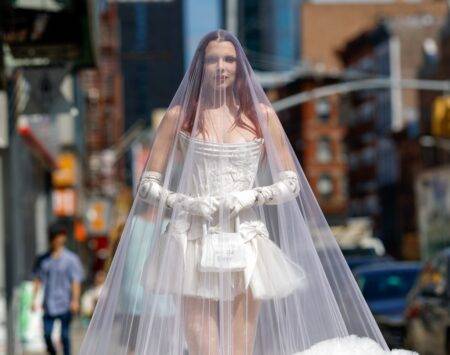 Julia Fox swaps aisle for New York streets as she stuns in outrageous wedding dress and fur-lined veil