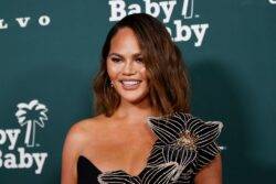 Chrissy Teigen’s entire dress splits open at star-studded event