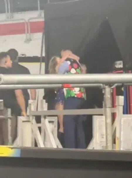 Taylor Swift and Travis Kelce pictured kissing as she runs off stage at Eras Tour