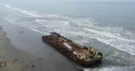 Two mystery ‘ghost ships’ wash up on beach and tourists start climbing on them