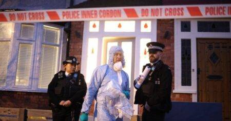 Woman found stabbed to death after man hands himself in to police