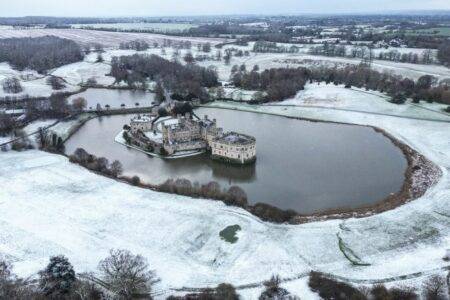 Arctic air brings snow and ice across UK as weather warnings issued