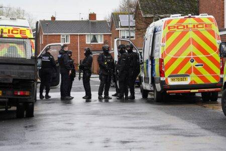 Primary school ‘on lockdown’ after armed police swarm estate