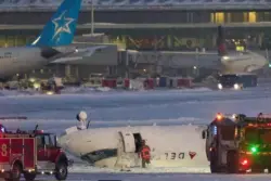 Crash landing as plane flips at Toronto airport